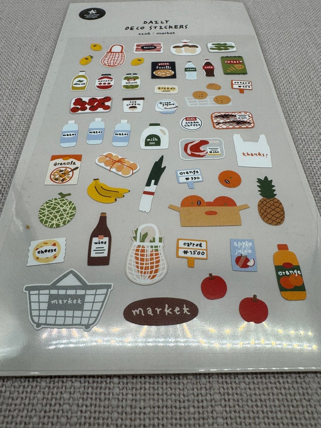 Mini Sticker auf einem Sheet. Man sieht diverse Motive, die mit Supermarkt in Verbindung stehen: einen Einkaufskorb, Bananen, Ananas, Einkaufstüte, Äpfel, Ladenschild etc. 